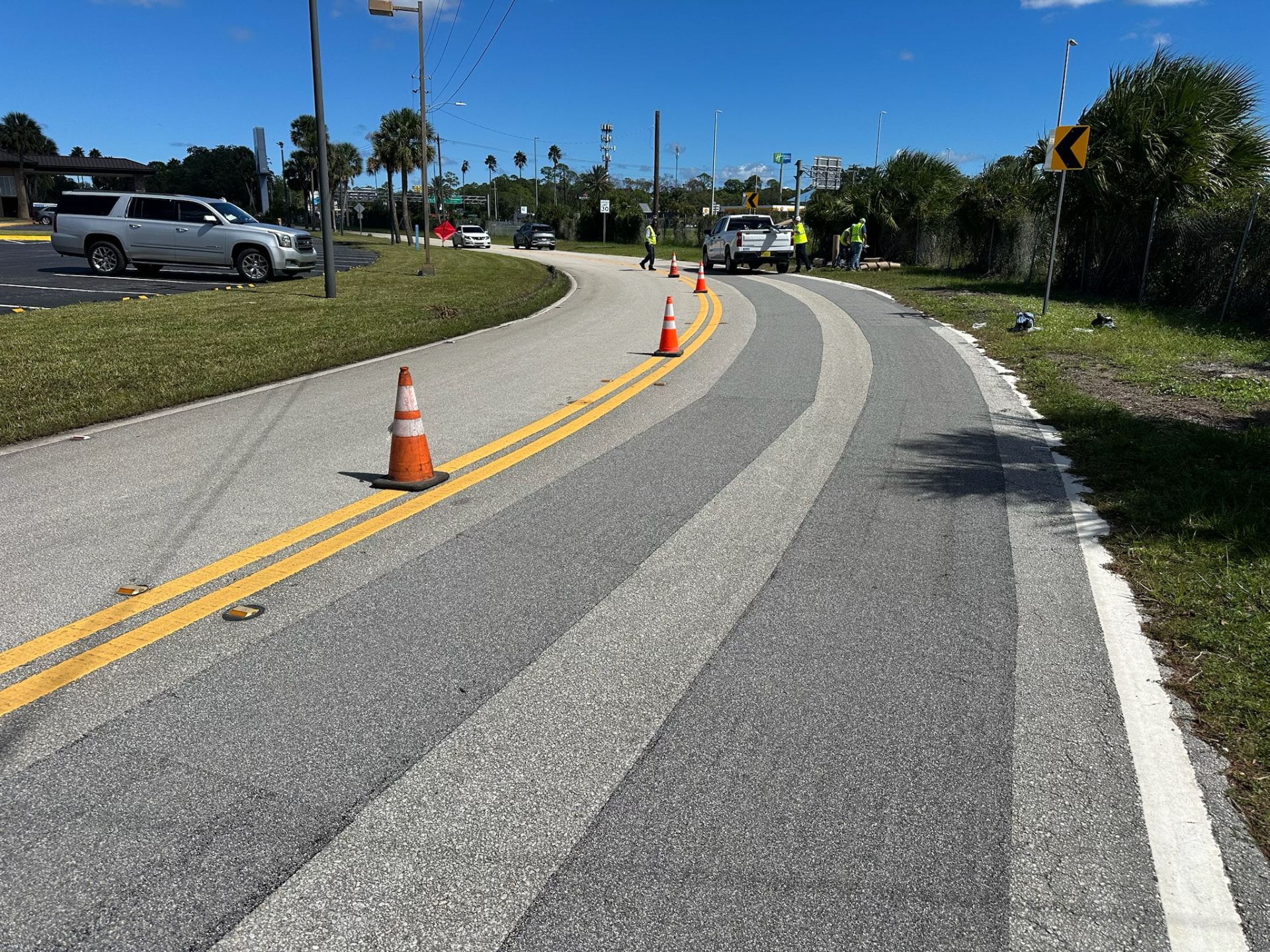 Roadway Safety Strip product application photograph — high-friction surface treatment on a paved curve or intersection