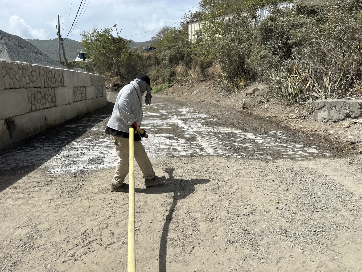 Solid Earth product application photograph — soil stabilization on an unpaved road or construction site